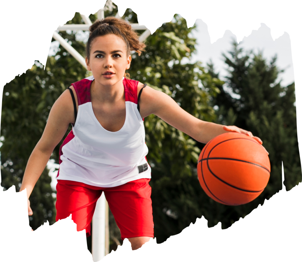 A teenage athlete playing basketball, highlighting the importance of sports injury recovery for teenage athletes."